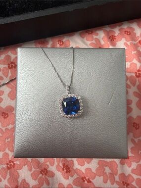 Silver Necklace with Cushion Blue Pendant and Halo Accent